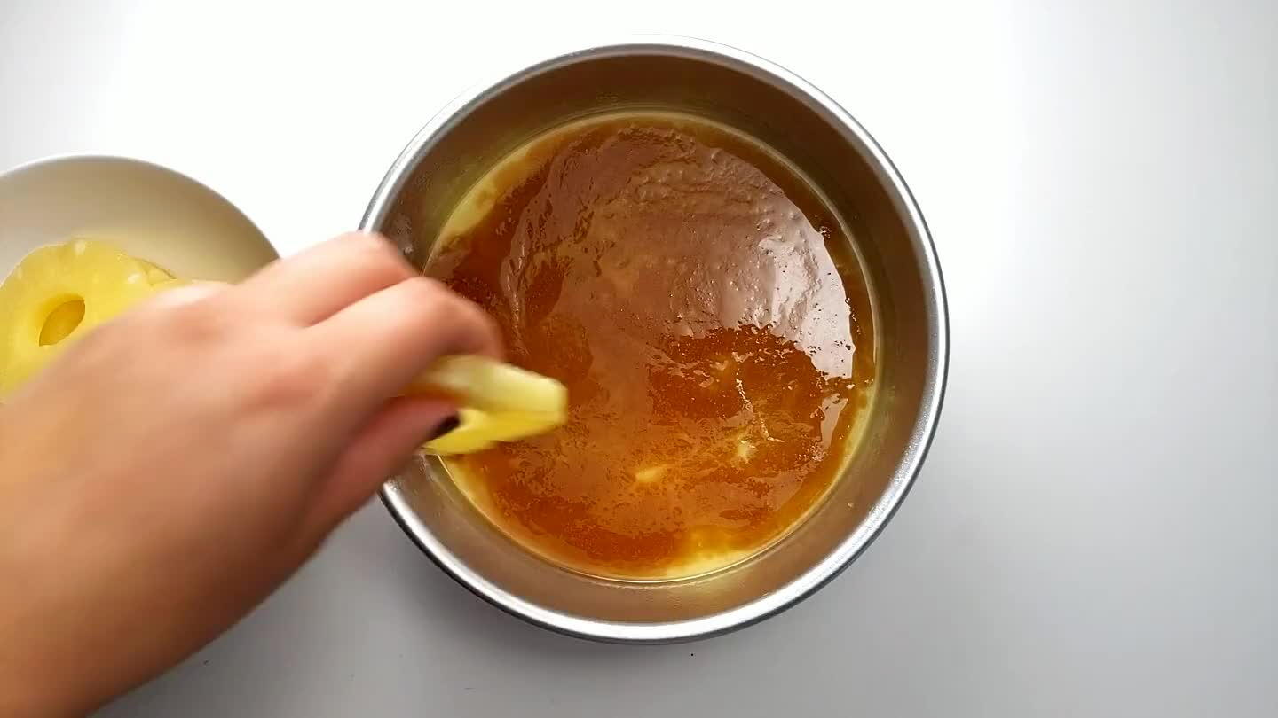 add one in the middle. Save 1/4 cup of the pineapple juice from the can to add into the batter. Make sure the rings are drained well and not holding onto excessive juice.