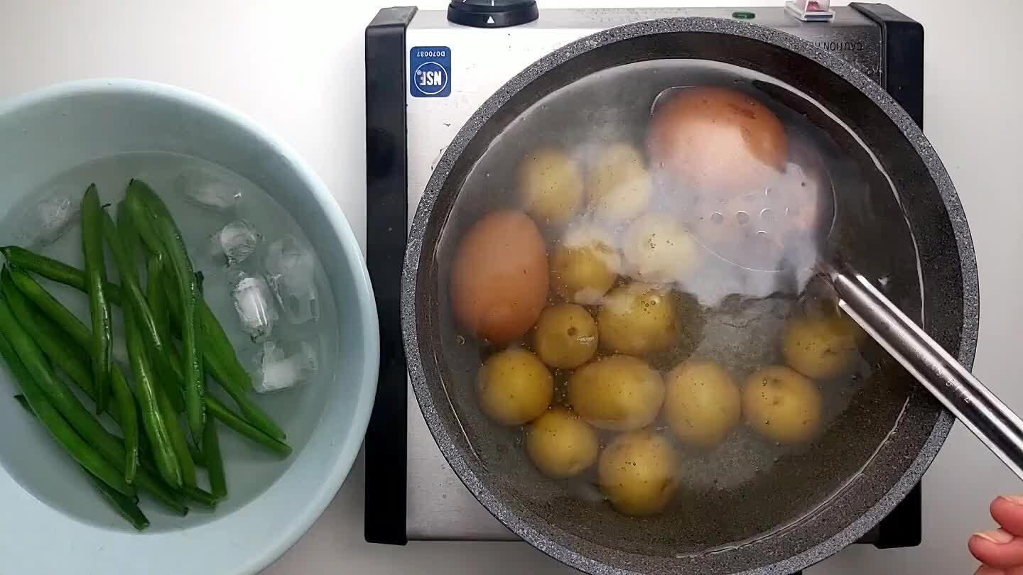 bath. Once the potatoes are cooked (about 12 minutes) remove the from the boiling water as well.