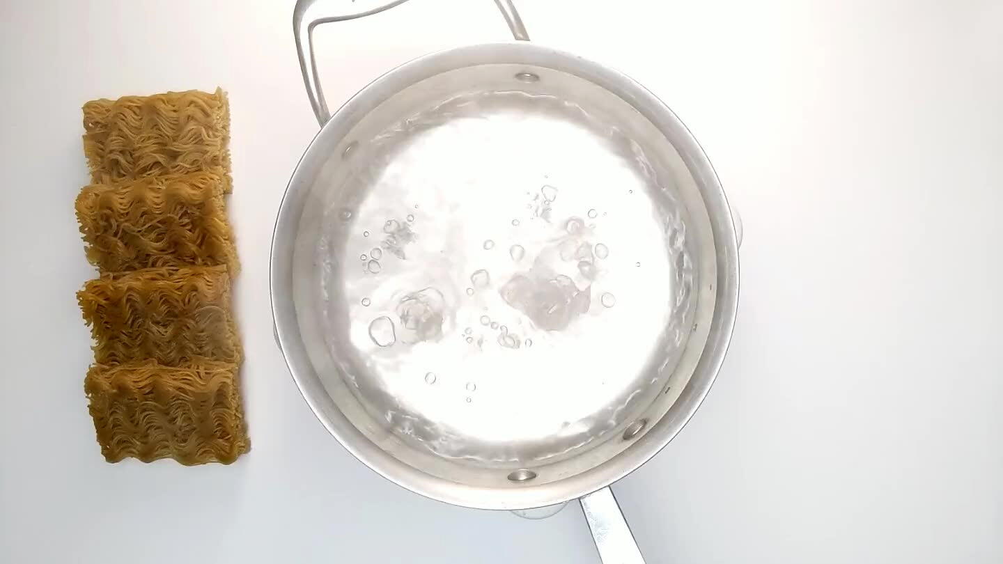 After about a minute the noodles will soften enough that you can gently separate them with a fork or a set of chopsticks, just like making top ramen. After about 4 minutes, the noodles should be tender. Strain them and set them aside.
