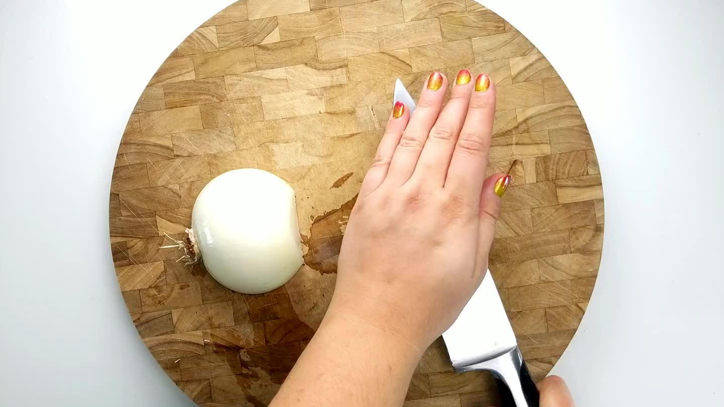 , leaving the root end intact. Slice accross the onion into strips and then dice.