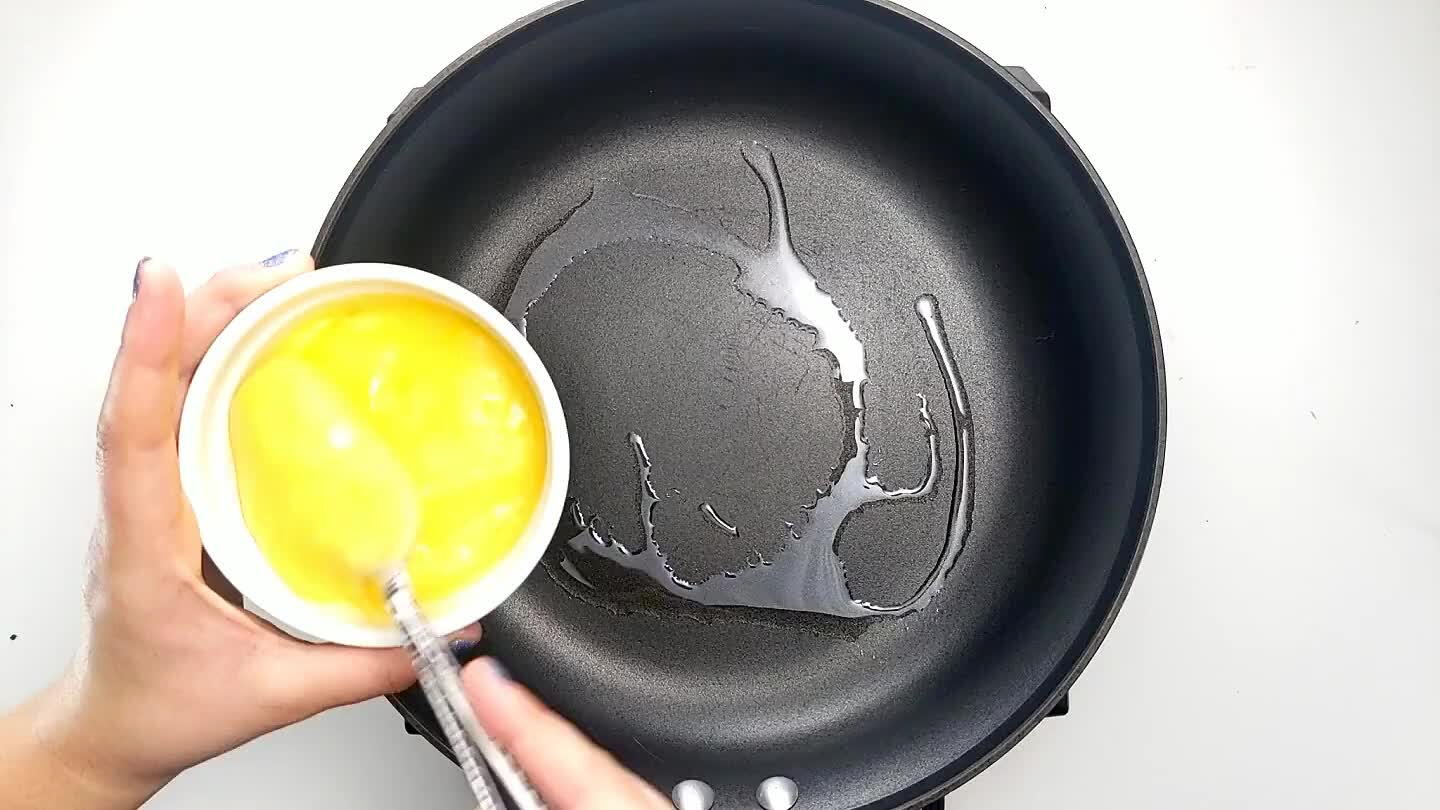 in a small bowl. Bring up to medium-high heat and pour the egg into an even layer. Cover for a minute or two with a lid until mostly cooked through. Remove and place on a cutting board.