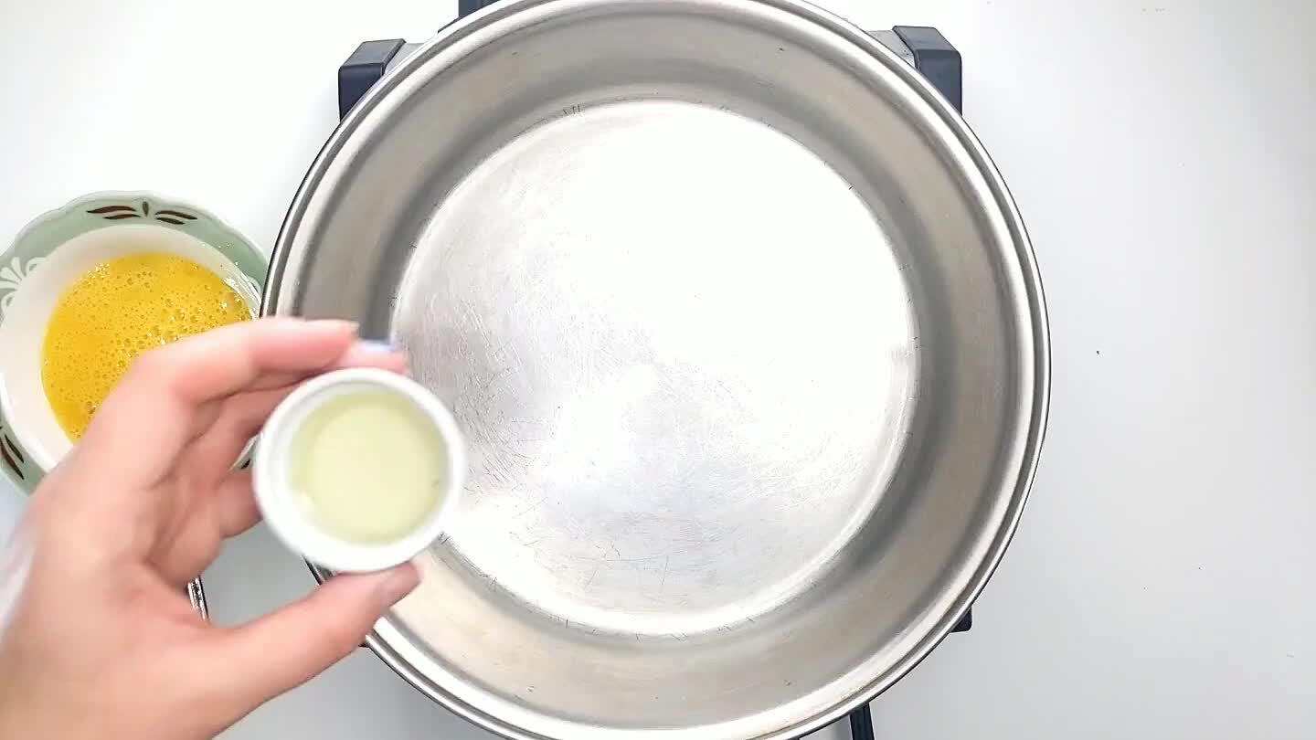 of oil to a pan and pour in the egg.
