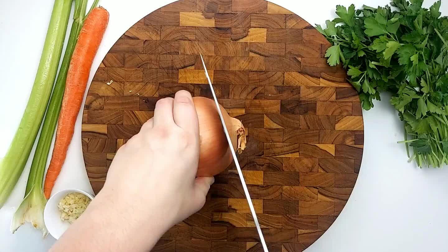 the onion with the knife parallel to the cutting board and then slice down and accross into strips. Then dice.