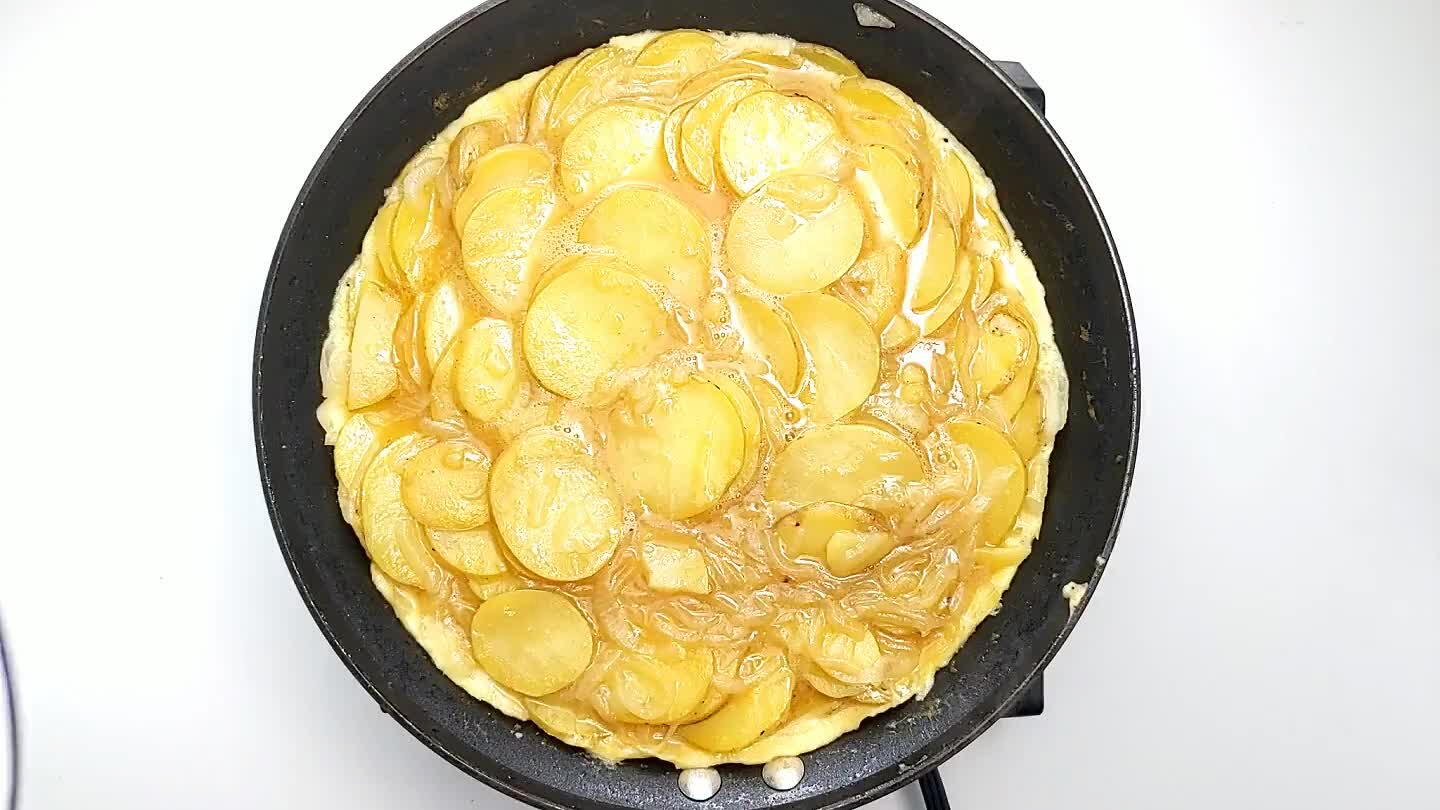 han the pan. Then slide the tortilla off of the plate to cook on the other side.