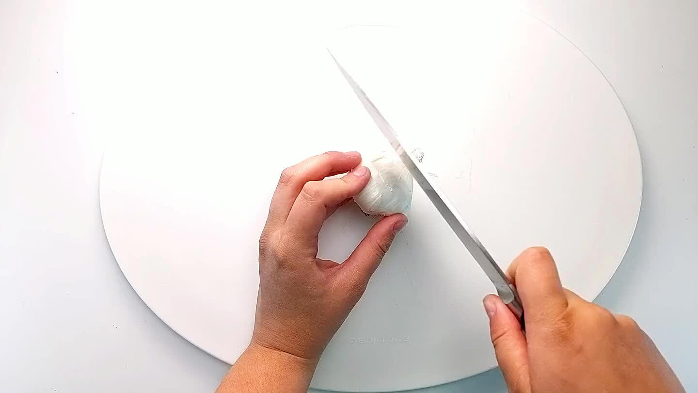 Remove any excess garlic skins. Remove any cloves that didn't get cut open and save for another use.
