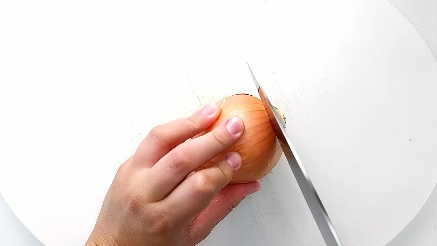 into the onion with the knife parallel to the cutting board. Then slice into strips and dice.