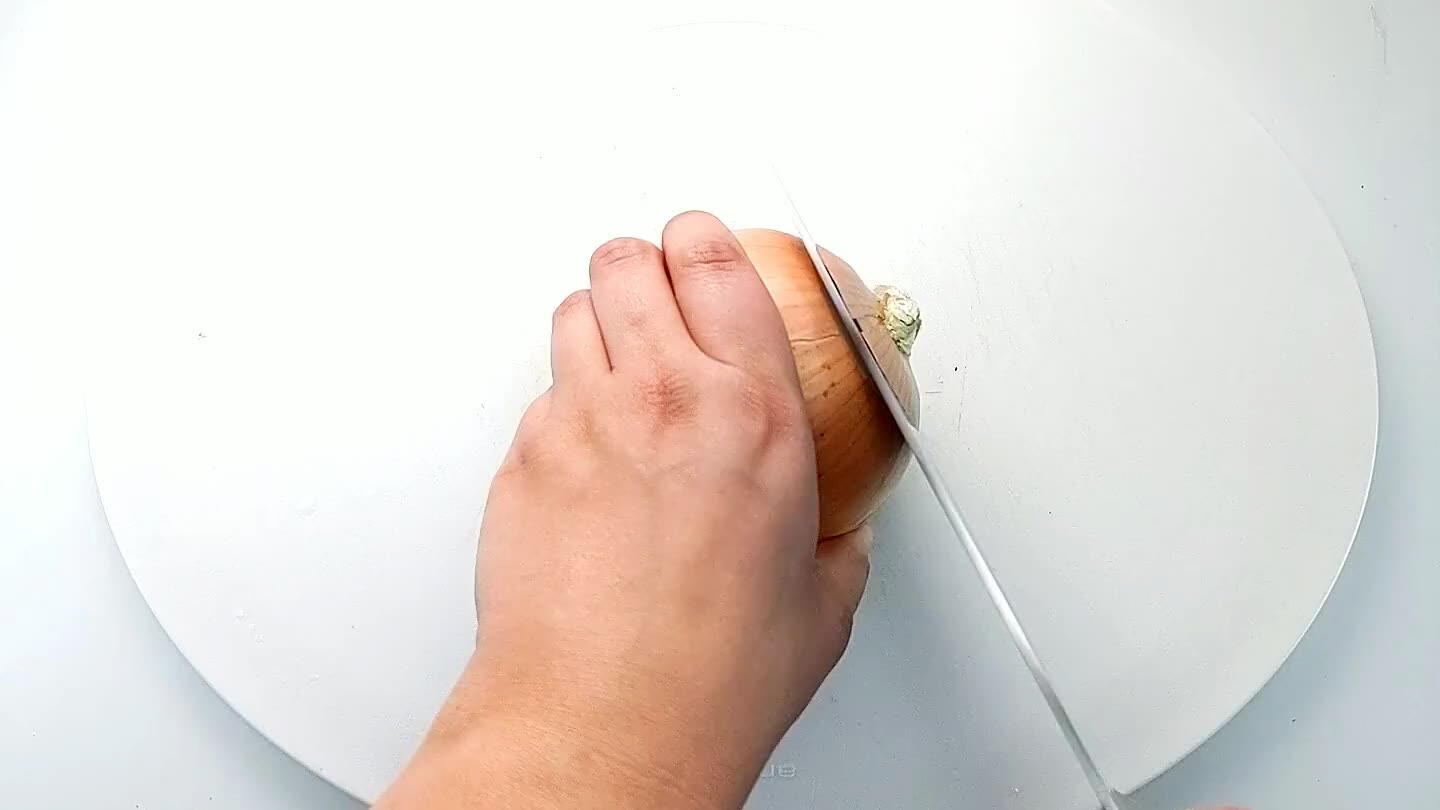 into the onion with the knife parallel to the cutting board. Then slice into strips and dice.
