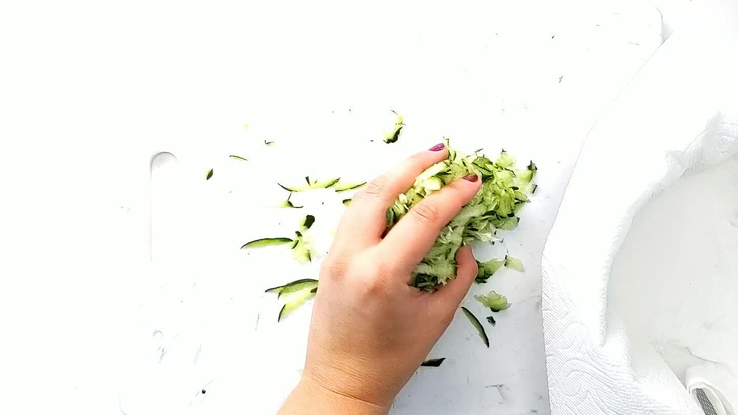 ese cloth draped over a colander. Carefully squeeze excess water from the shredded cucumber. At this point, measure 1/2 cup of drained cucumber and add to a mixing bowl.