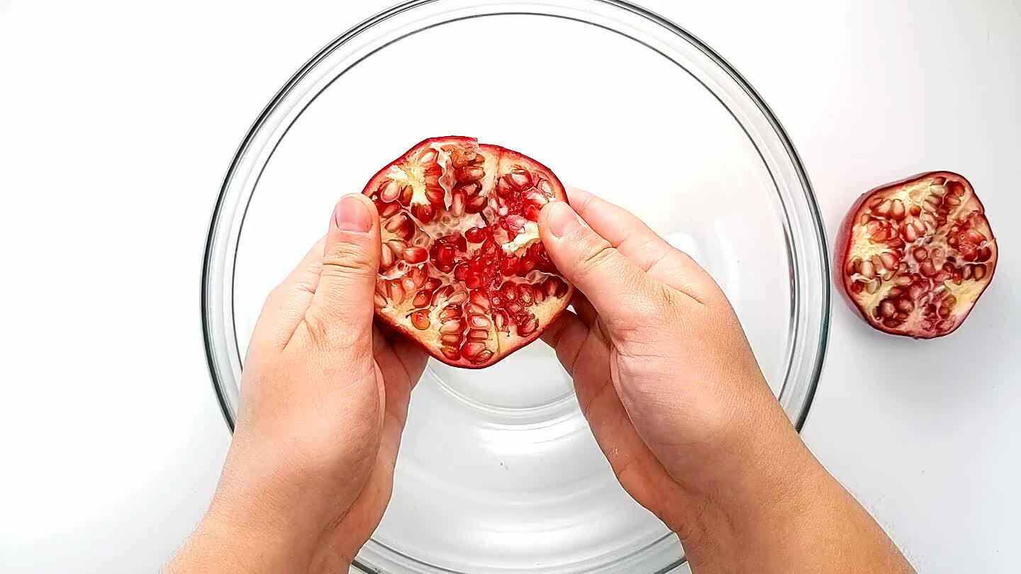 much. Pull the segments apart and hold the half in your hand with the open side down. Whack the back of the pomegranate with the back of a wooden spoon using a good bit of force, and the airls will come out into the bowl.