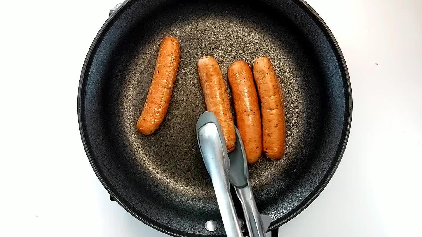 If they look like they may burst, make a shallow cut into the side to allow steam to escape. Remove the sausages from the pan and set aside.
