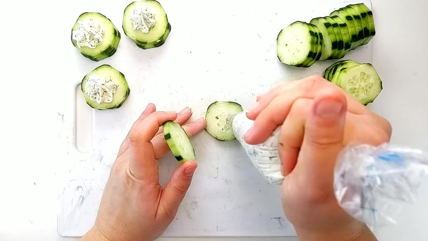 another cucumber slice on top and add another dollop of cream cheese.