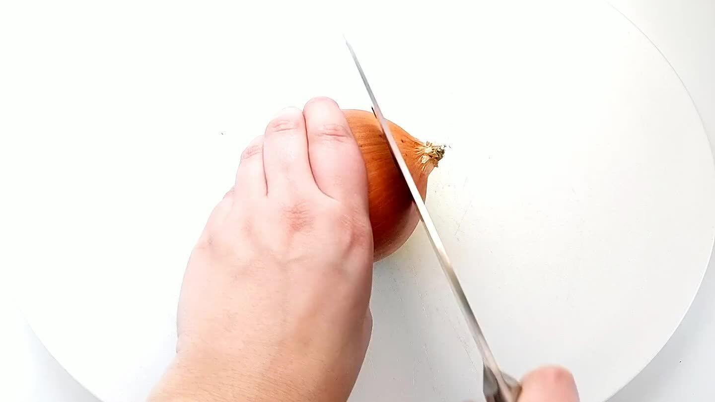 into the onion with the knife parallel to the cutting board. Slice the onion across into strips, again keeping the root in tact. Cut perpendicularly to dice. Set half of the onion aside for another recipe.
