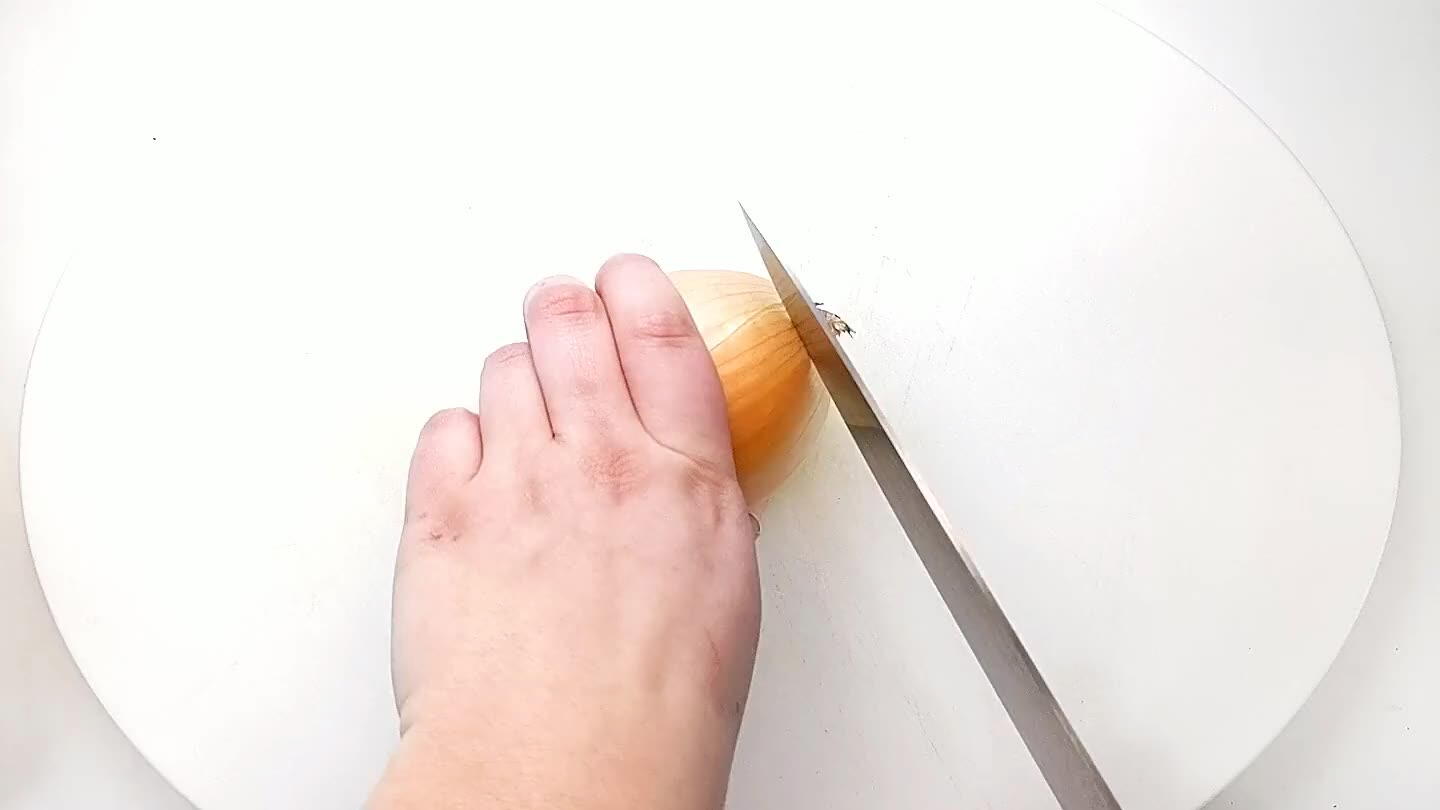 into the onion with the knife parallel to the cutting board. Then slice into strips and dice.