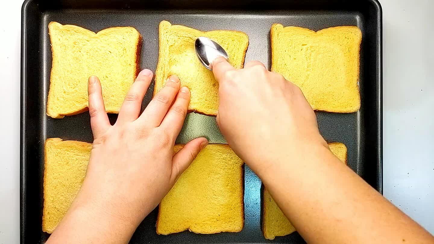 rt custard. Spoon the custard onto the toast and spread out to the edges.
