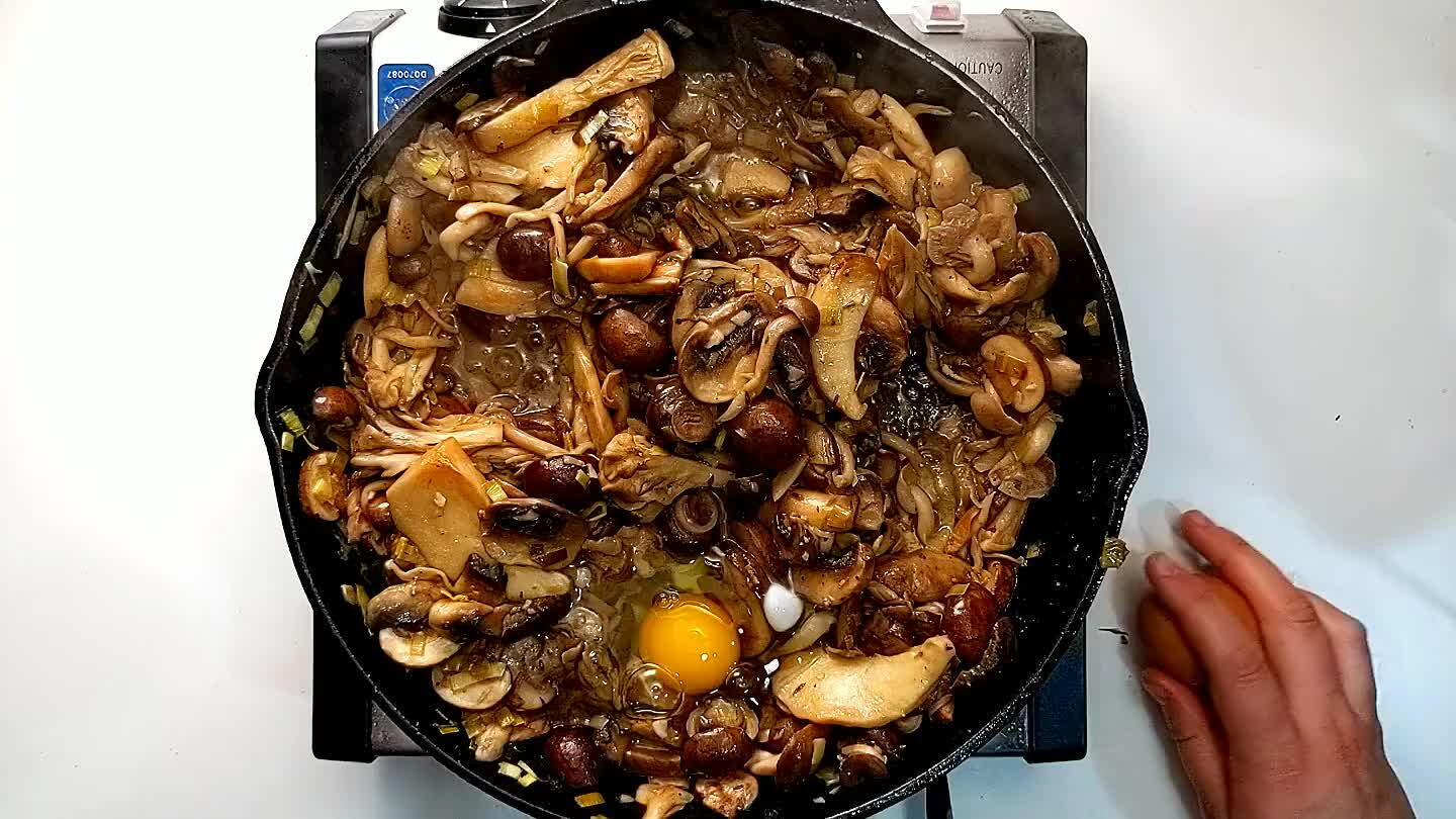 egg into each one. Top the skillet with a lid and cook the eggs until the whites are fully cooked but the yolks are still runny.