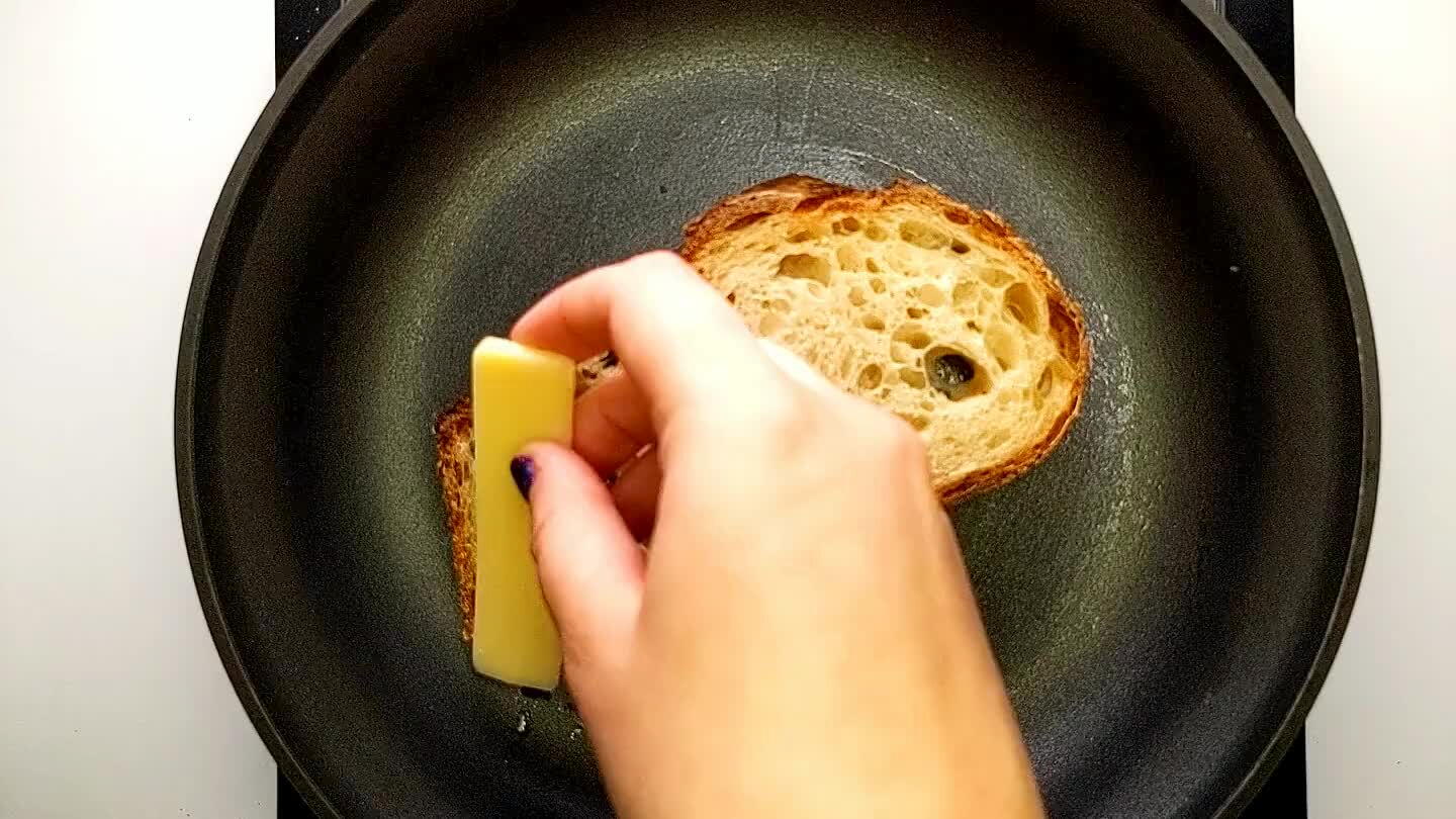 bread with a generous layer of gruyere. Add a nice layer of caramelized onions and the top piece of bread.