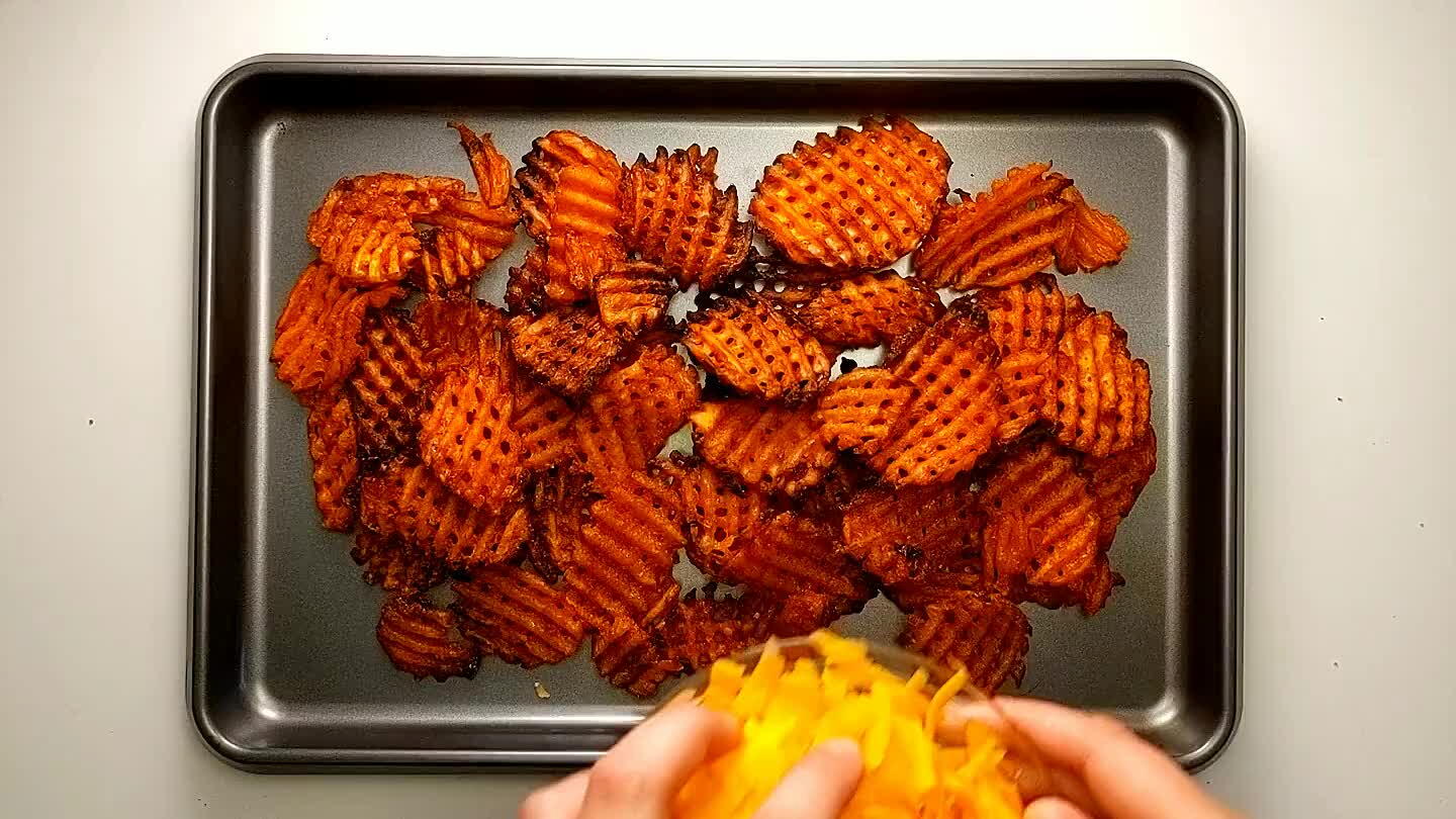 e and arrange the sweet potato fries in a pile in the middle. Sprinkle them with the cheddar cheese. Put under the broiler for a few minutes until melted.